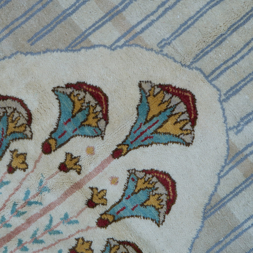 rug in brown wool with transitional floral motif, demonstrating handwoven rug craftsmanship.