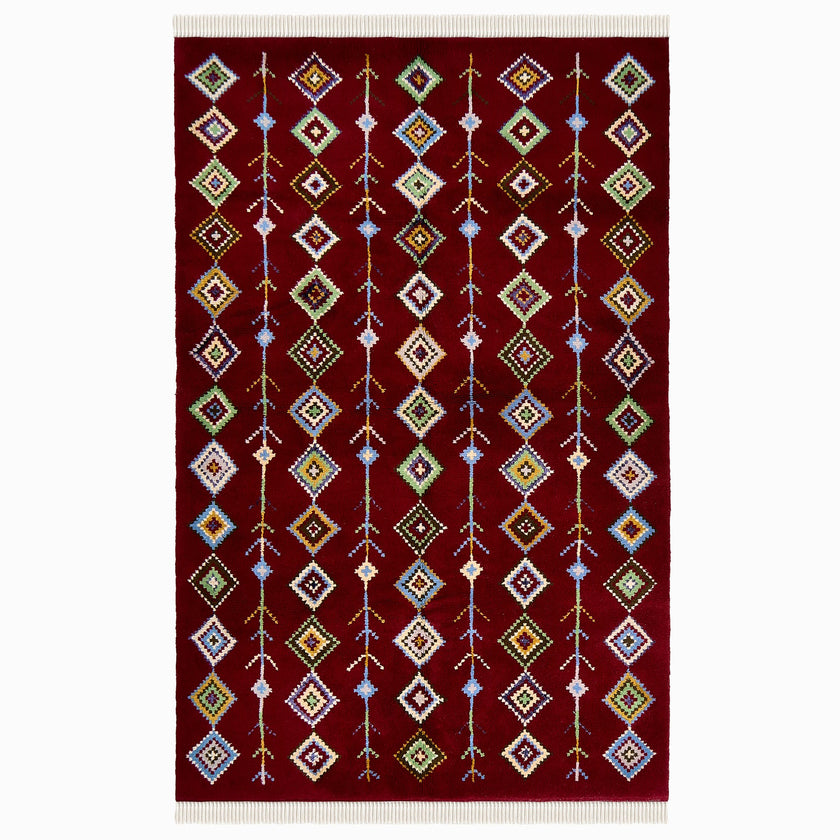 rug in deep red wool with diamond pathway motif, demonstrating handwoven rug craftsmanship.