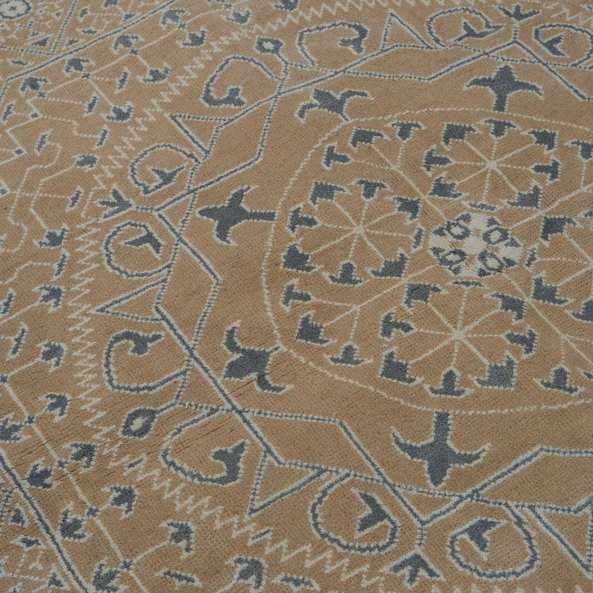 rug in taupe wool–cotton blend with mandala geometric motif, demonstrating handwoven rug craftsmanship.