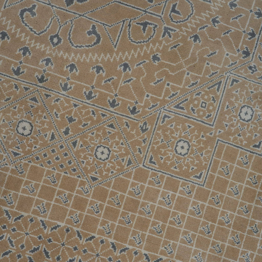 rug in taupe wool–cotton blend with mandala geometric motif, demonstrating handwoven rug craftsmanship.