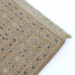 rug in taupe wool–cotton blend with mandala geometric motif, demonstrating handwoven rug craftsmanship.