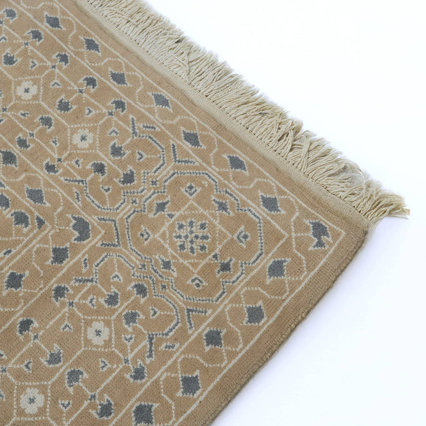 rug in taupe wool–cotton blend with mandala geometric motif, demonstrating handwoven rug craftsmanship.