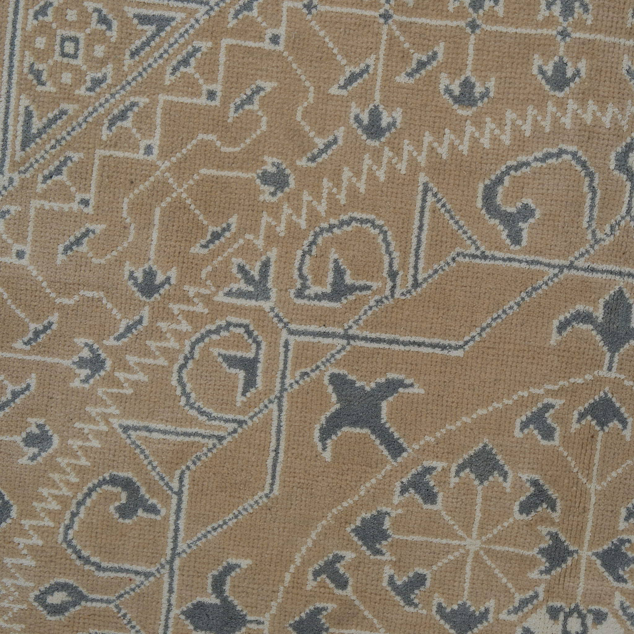 rug in taupe wool–cotton blend with mandala geometric motif, demonstrating handwoven rug craftsmanship.