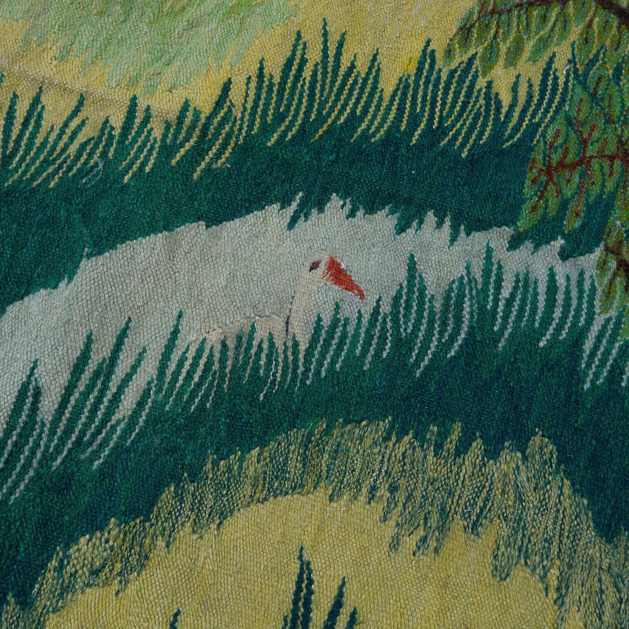 wall art in teal/green wool with nature landscape motif, demonstrating handwoven rug craftsmanship.