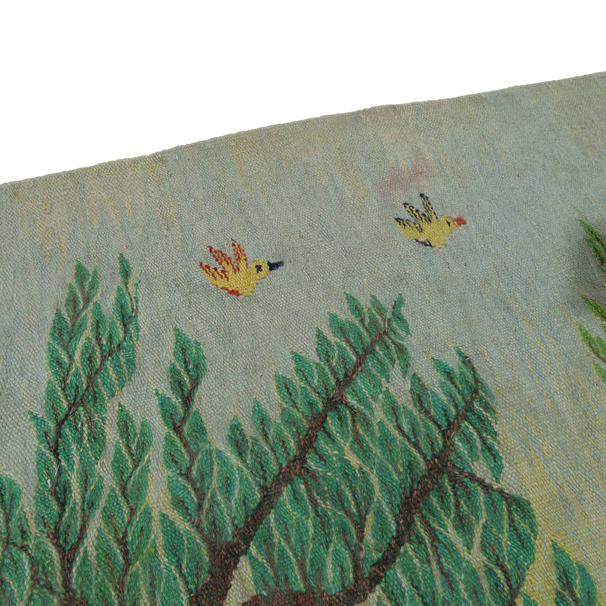 wall art in teal/green wool with nature landscape motif, demonstrating handwoven rug craftsmanship.