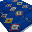 rug in vivid blue wool with tribal diamond motif, demonstrating handwoven rug craftsmanship.
