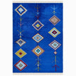 rug in vivid blue wool with tribal diamond motif, demonstrating handwoven rug craftsmanship.